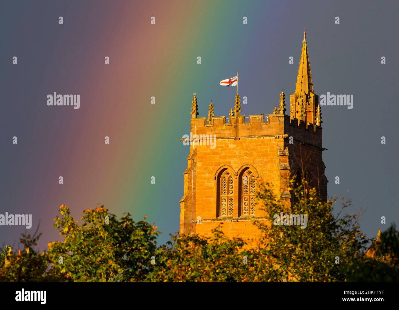 Rainbow beside the tower of St Leonard's Church, Bridgnorth, Shropshire. Stock Photo