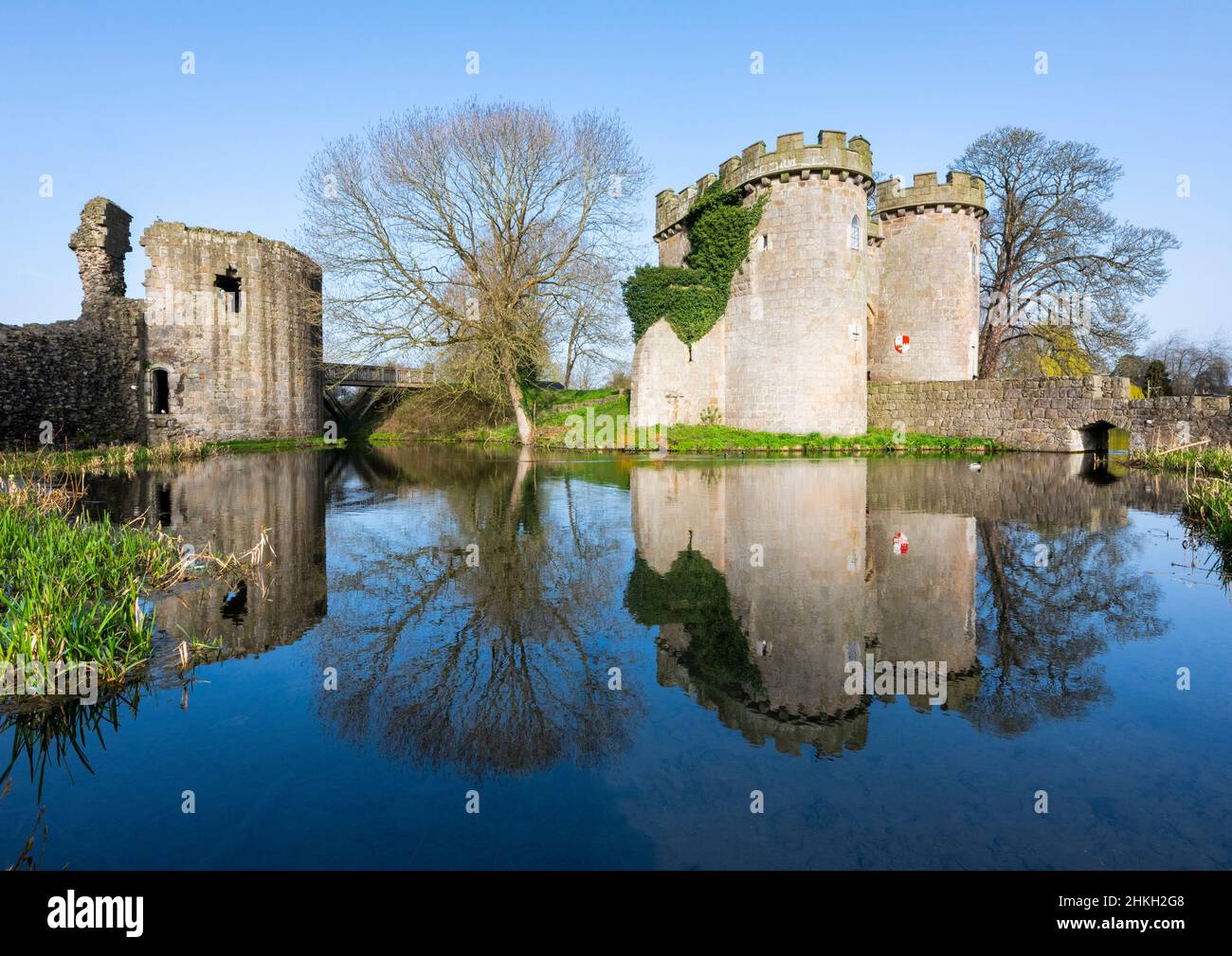 Whittington Castle reflected in the castle moat, Whittington, Shropshire. Stock Photo
