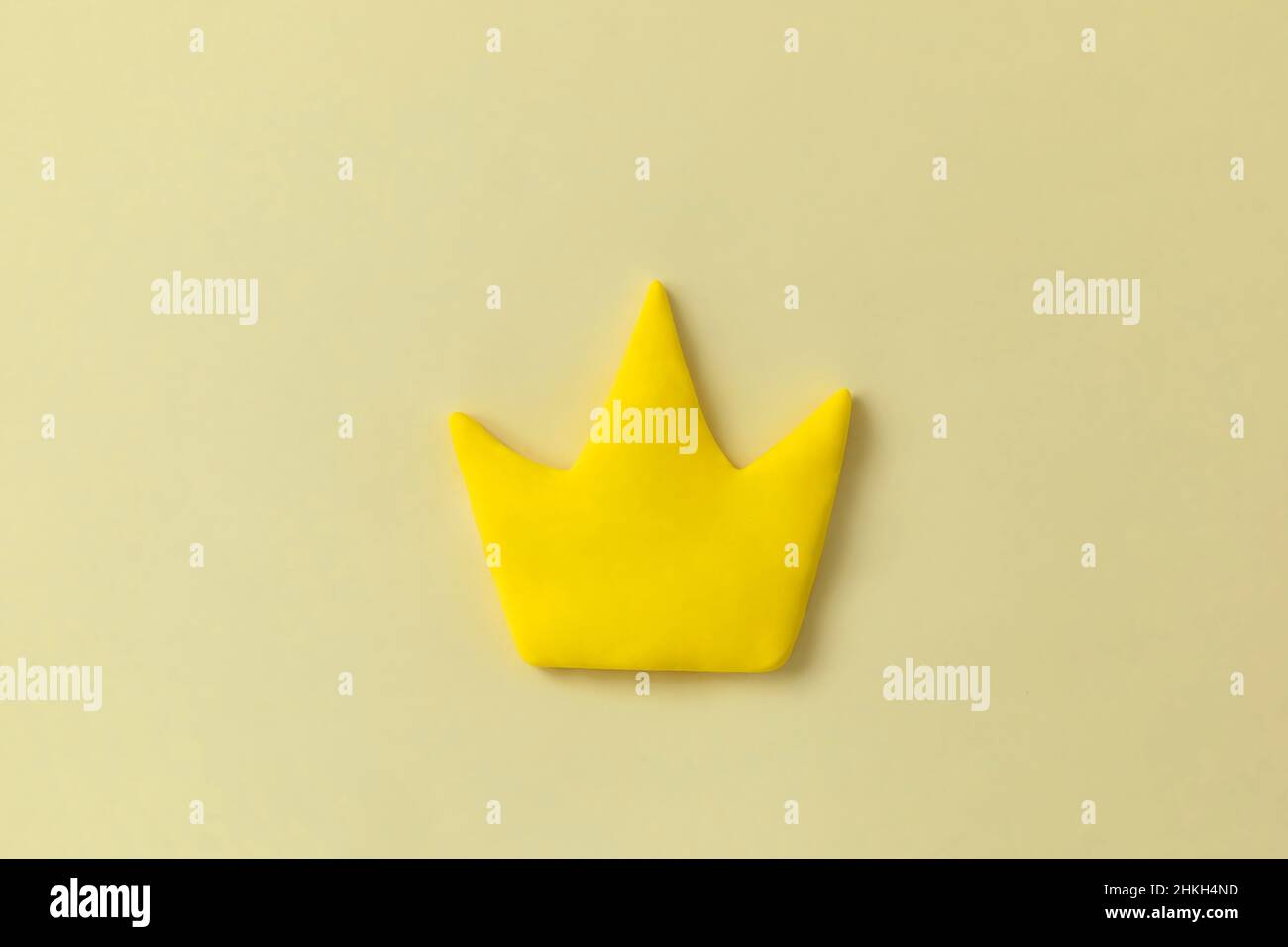 Simple 3d yellow crown symbol on yellow background. Concept of win and success, king sign, top rank quality status. Stock Photo