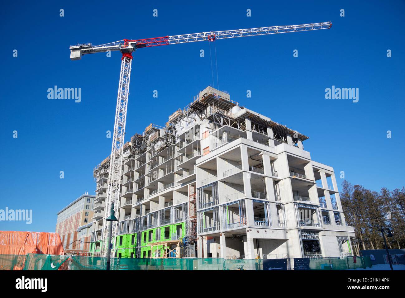 Toronto, Ontario / Canada - 01/28/2022: Building construction site with crane and blue sky background Stock Photo