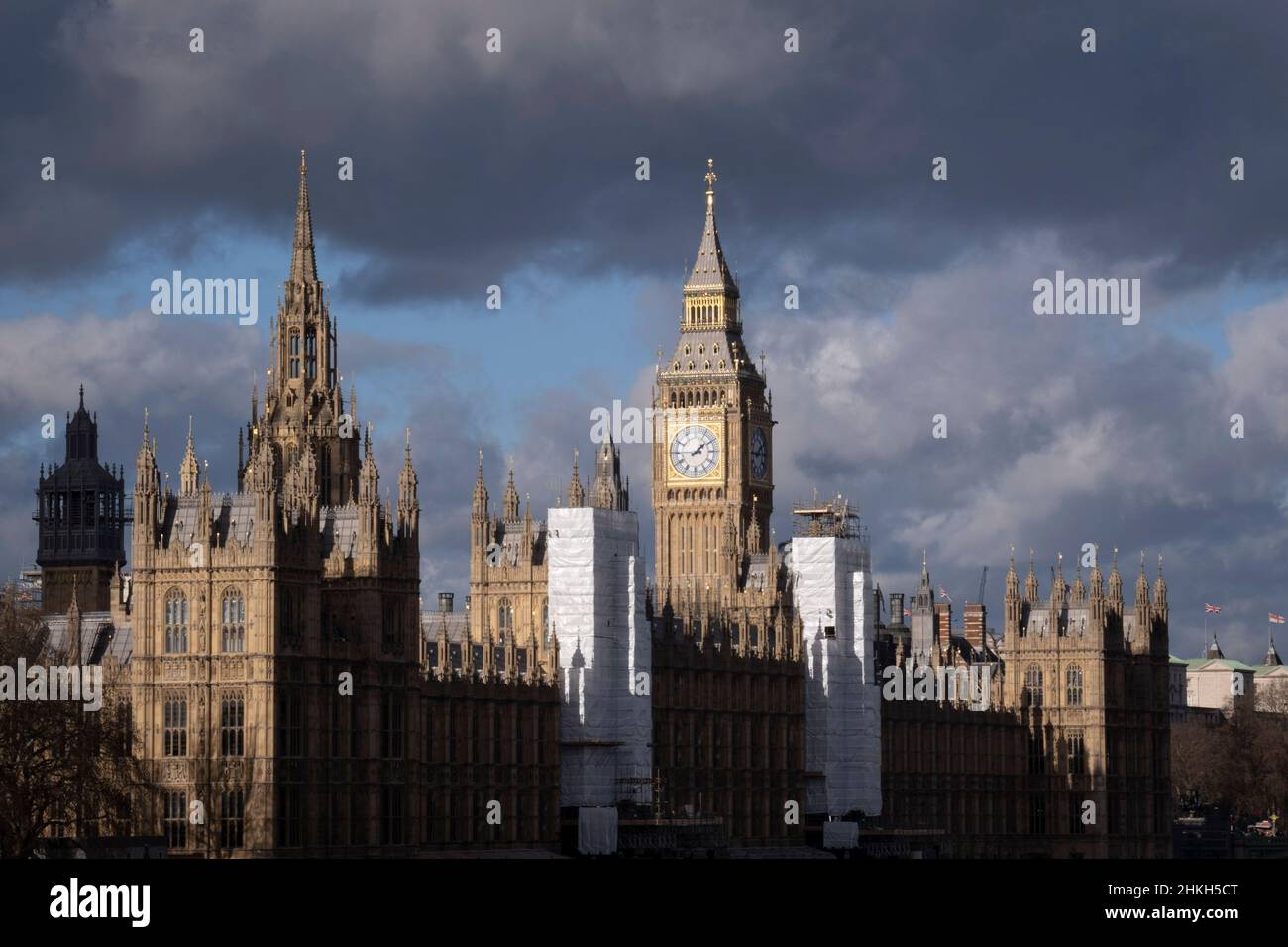 Following the five-year conservation project of the Houses of Parliament, scaffolding is finally coming down to reveal its renovated architecture, on 4th February 2022, in London, England. Some construction sheeting remains and apart from New Year chimes, the Big Ben bell inside the Elizabeth Tower, has remained silent during parliament's extensive renovation by contractor Sir Robert McAlpine with an approximate cost of £61m. Stock Photo