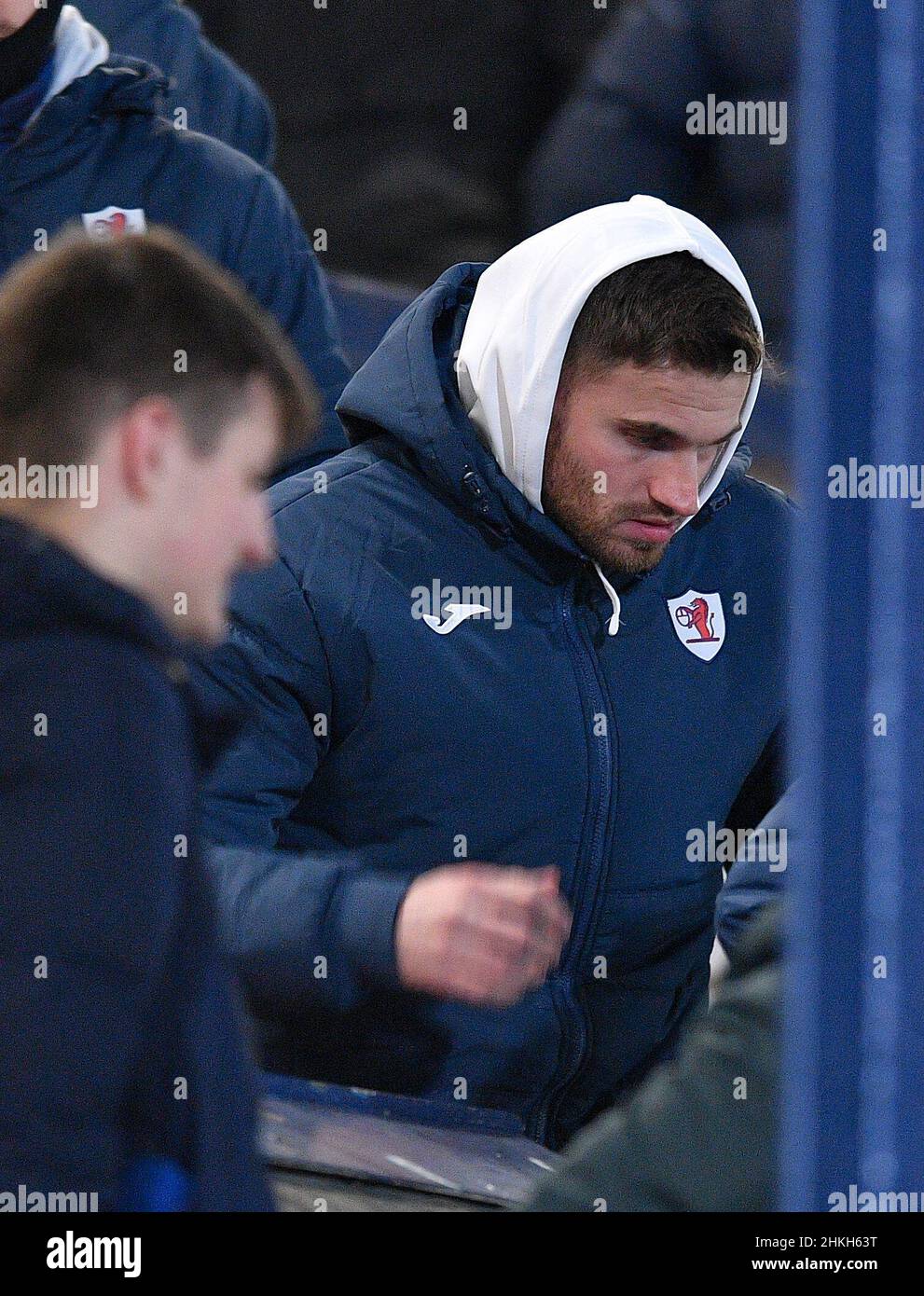 David Goodwillie, who was judged in a civil case to have raped a woman and ordered to pay substantial damages, sits in the stand to watch his new team Raith Rovers play Queen of the South on Tuesday 05 February 2022. The decision to sign Goodwillie caused widespread outrage, and led to the Kirkcaldy club cancelling his signing two days later.  (c) Dave Johnston Stock Photo
