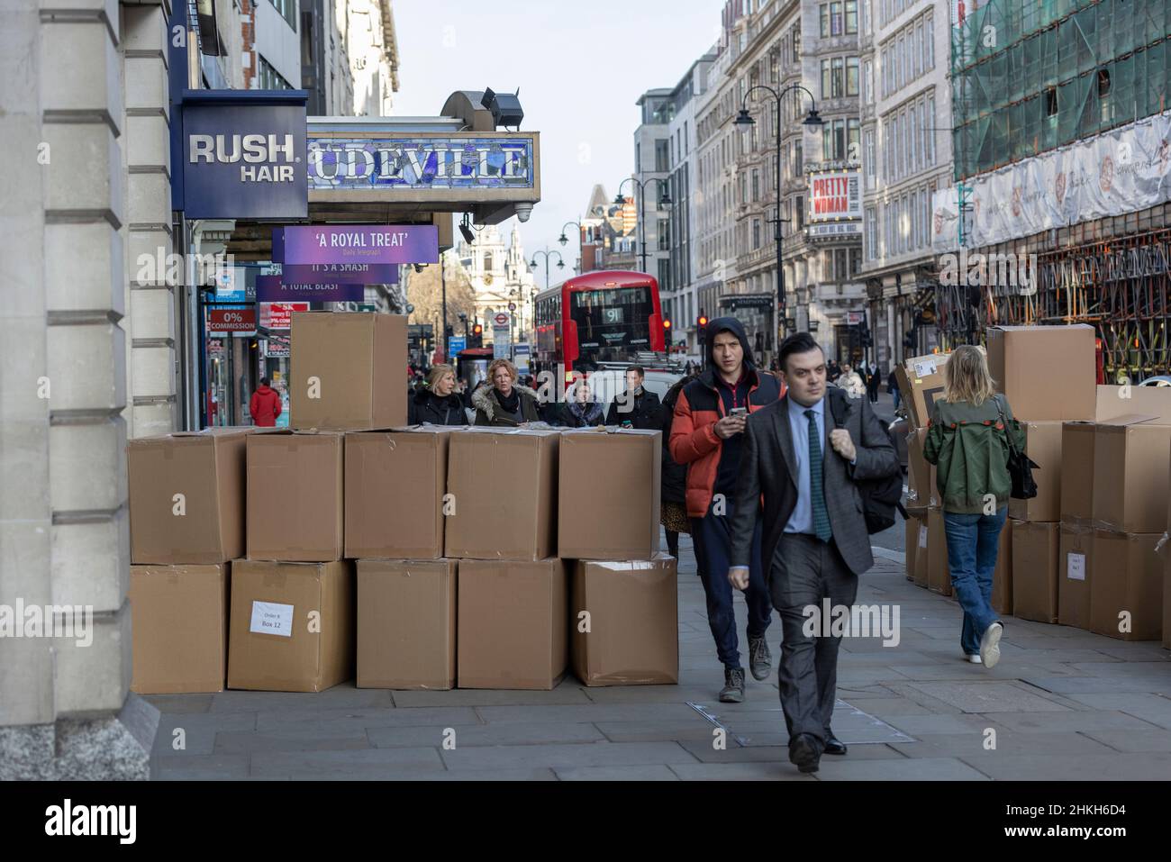 Cardboard boxes outside of a high street retail clothing shop as workers and shoppers slowly return to the capital, London, England, United Kingdom Stock Photo