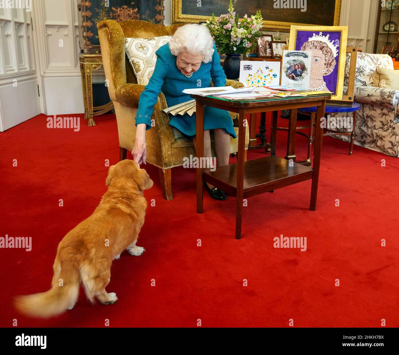 Queen Elizabeth II is joined by one of her dogs, a called Candy