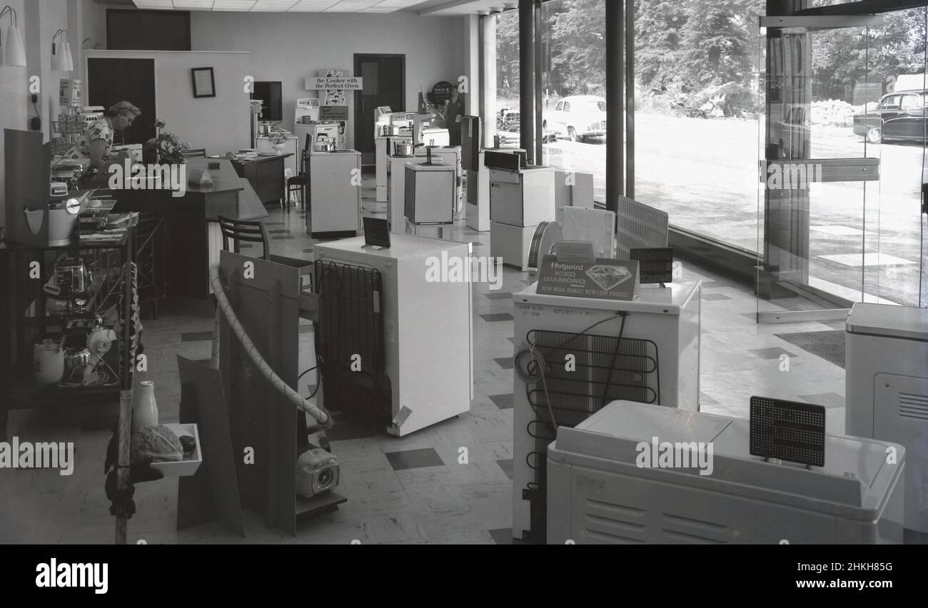 1960, historical, interior of a new modern glass fronted showroom of the Southern Electricity Service, Witney, Oxford, England, UK, showing the range of electric household applicances available. Southern Electricity was one of the 12 boards created under the British Electricity Board (BEA) when the electricity market was nationalised in 1948. Before then, there were over 600 different companies involved in the generation and supply of electricity, both public bodies such as local authorities and district councils and private power companies. Stock Photo