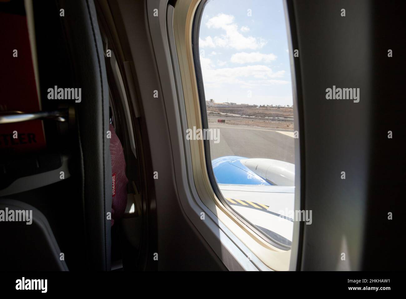 on board aircraft looking out window at arrecife airport Lanzarote Canary Islands Spain Stock Photo