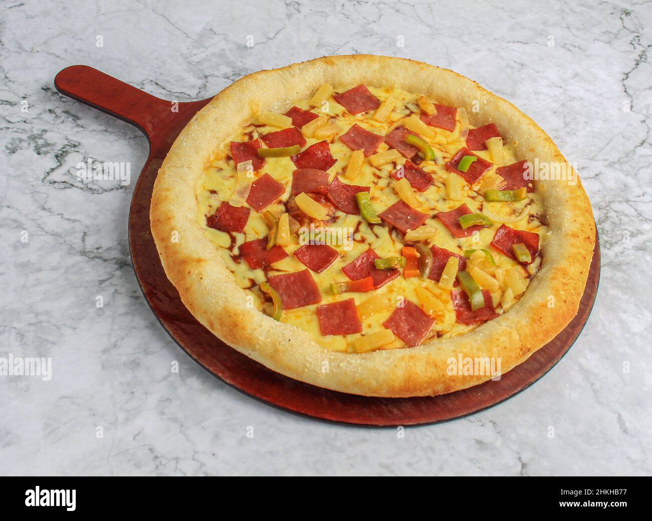 Double Cheese pizza Stuff Crust whole pizza tray on marble background