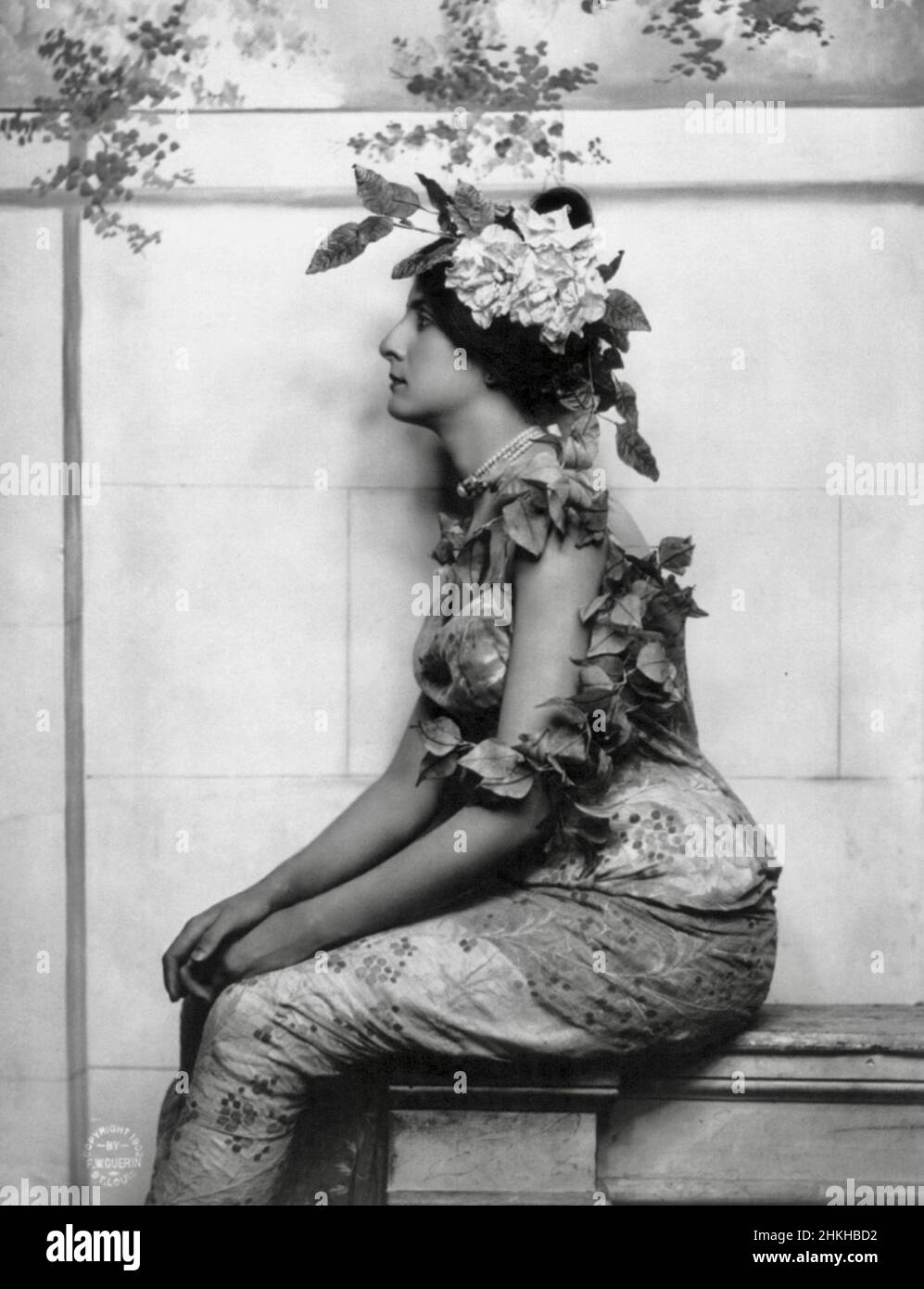 Fitz W Guerin, American photographer - Young Woman seated with Vine Draped over Head and Shoulder - 1902 Stock Photo