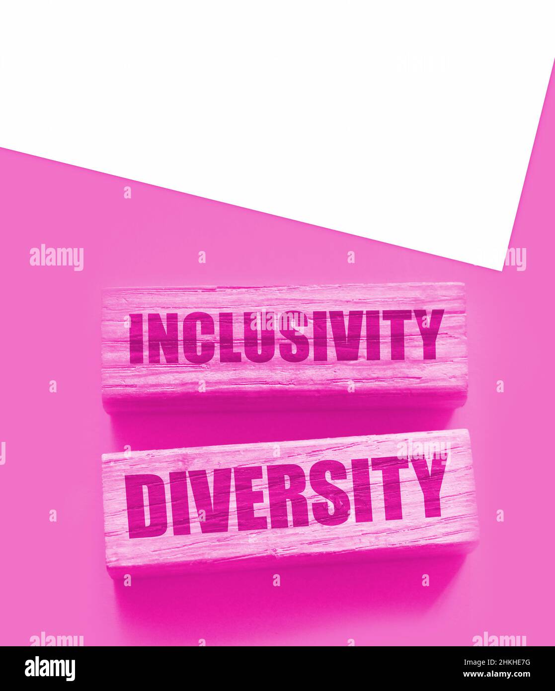 Inclusivity diversity words on wooden block on the yellow background ...