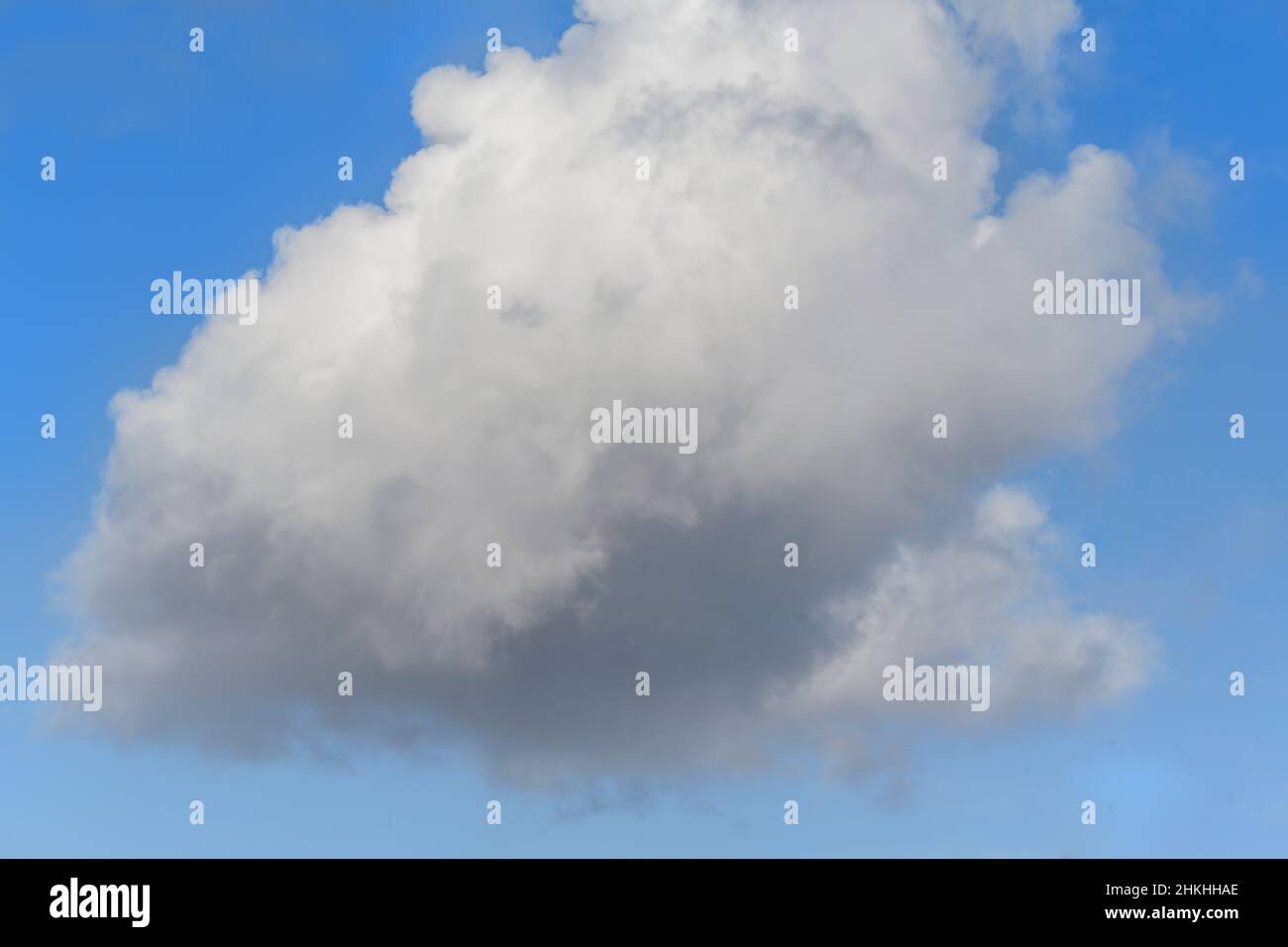 Large white cloud in the blue sky. Stock Photo