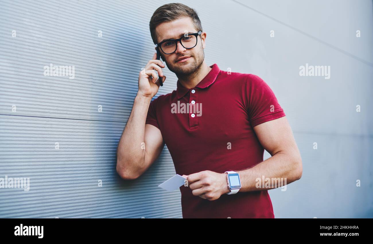 Cheerful male talking on smartphone Stock Photo