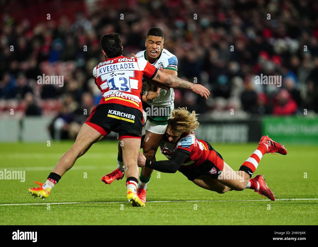 London Irish's Ben Loader (centre) tackled by Gloucester Rugby's Giorgi ...
