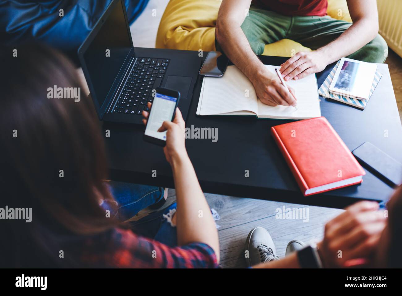 Students preparing for test sitting at table Stock Photo