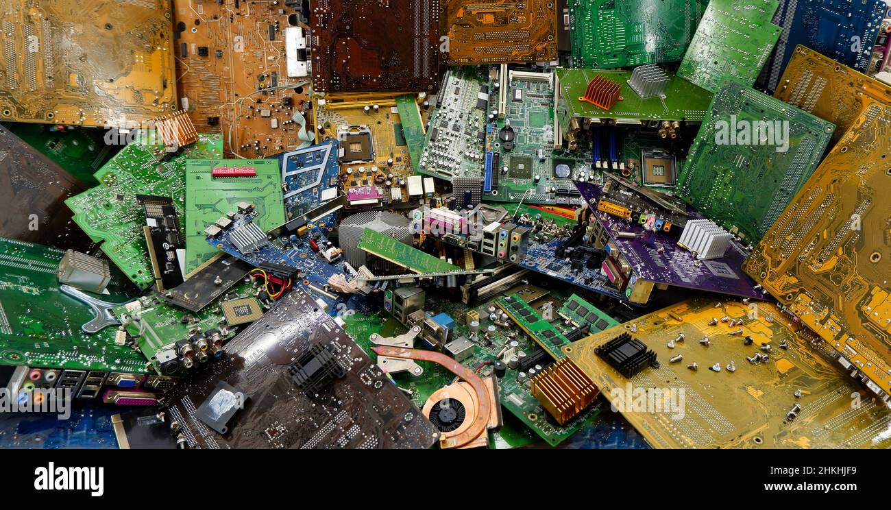 Electronic printed circuit boards in an electronics dump. Stock Photo