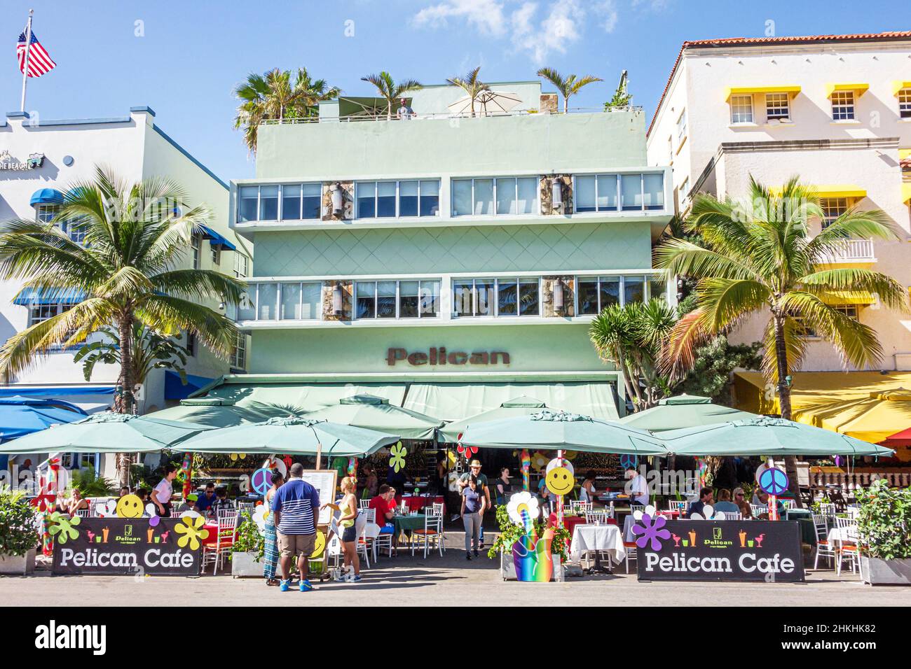 Miami Beach Florida,Ocean Drive,New Year's Day,hotel hotels,Pelican Cafe,restaurant dining al fresco outside tables umbrellas outside exterior Stock Photo
