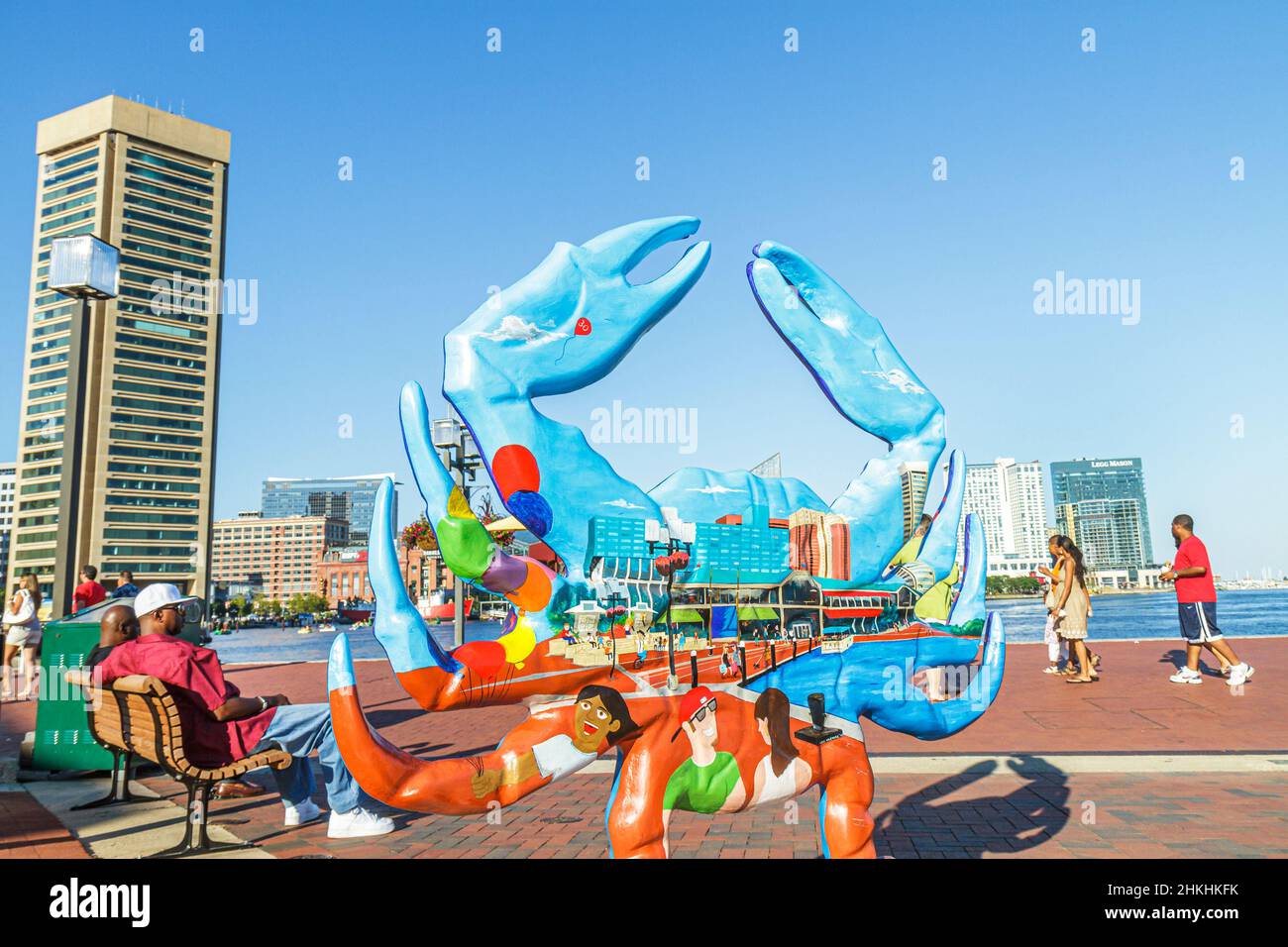 Baltimore Maryland,Inner Harbor Harborplace,Patapsco River World Trade Center,Black man woman couple,downtown skyline,fiberglass crab sculpture art Stock Photo