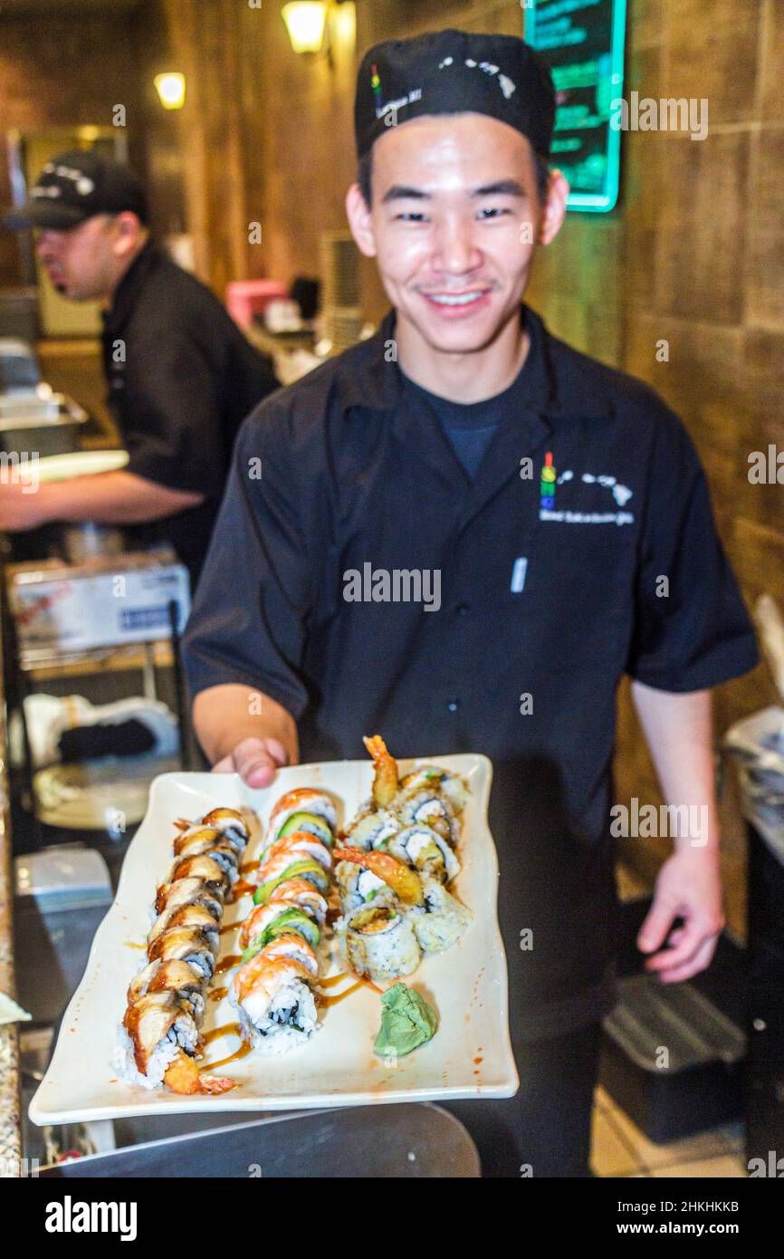 Las Vegas Nevada,Downtown,Plaza Hotel & Casino,Asian man,sushi chef server restaurant tray food Stock Photo