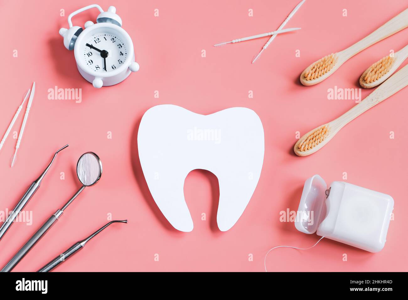 Dental care concept. Dental tools on pink background. Happy dentist day