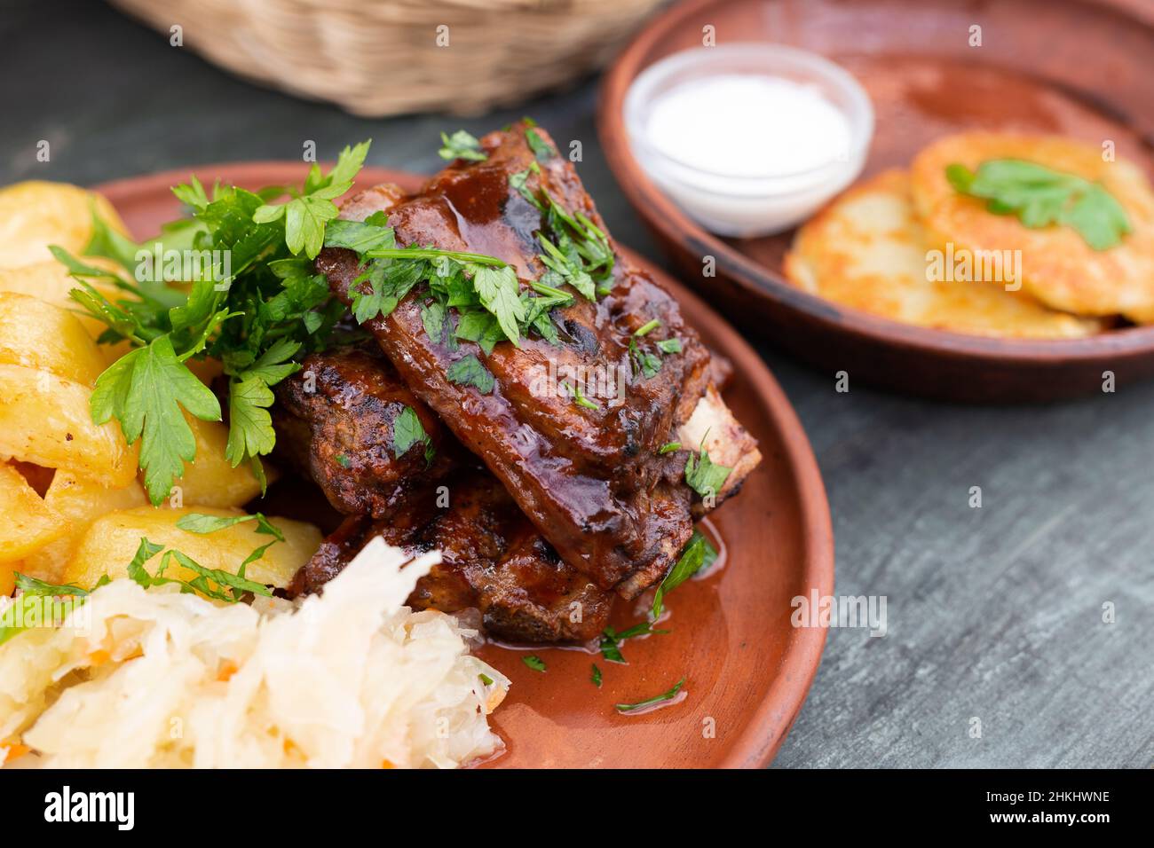 Bavarian baked pork ribs with boiled potatoes and sauerkraut closeup Stock Photo Alamy