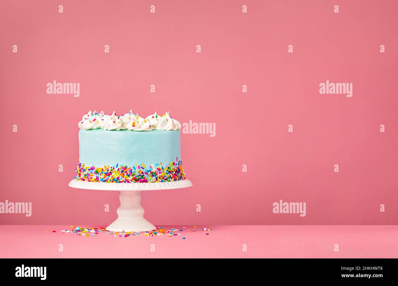 Blue Birthday Cake with white meringue decorations and colorful