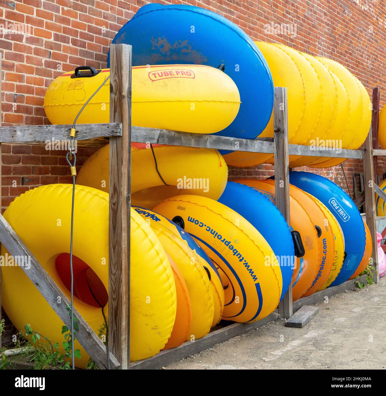 LANESBORO, MN - 26 AUG 2019: Stacks of yellow and blue inner tubes Stock Photo
