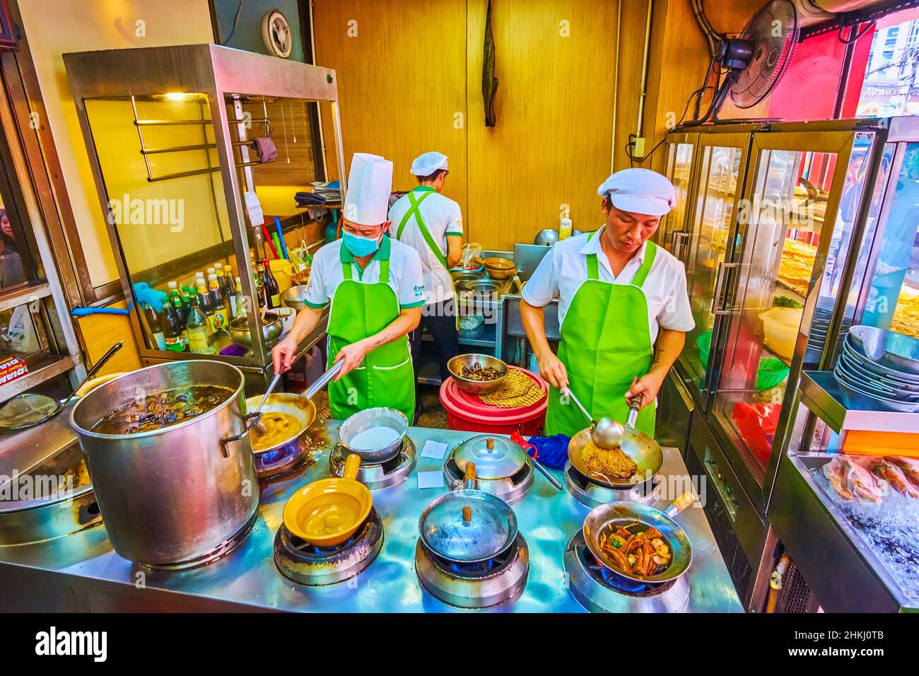 BANGKOK, THAILAND - MAY 12, 2019: The cooks prepares food in the the kitchen of Chinese restaurant in Chinatown, on May 12 in Bangkok Stock Photo