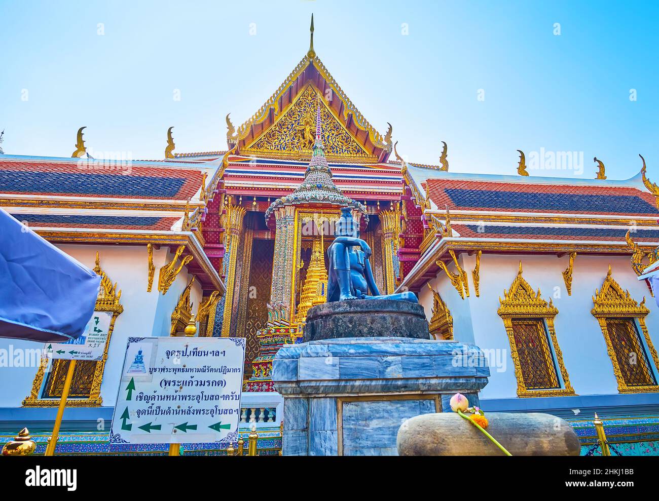 BANGKOK, THAILAND - MAY 12, 2019: The colorful facade of the side wall of Phra Ubosot shrine with sculpture of sitting Buddha, on May 12 in Bangkok Stock Photo