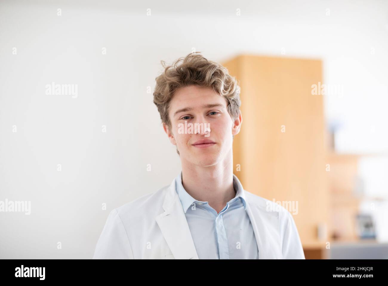 young doctor male with coat in a doctor's office Stock Photo