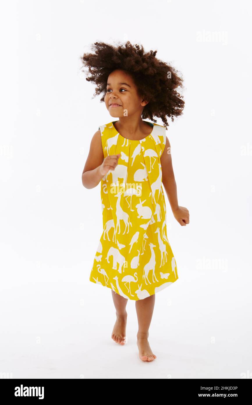 Little girl in yellow dress Stock Photo - Alamy