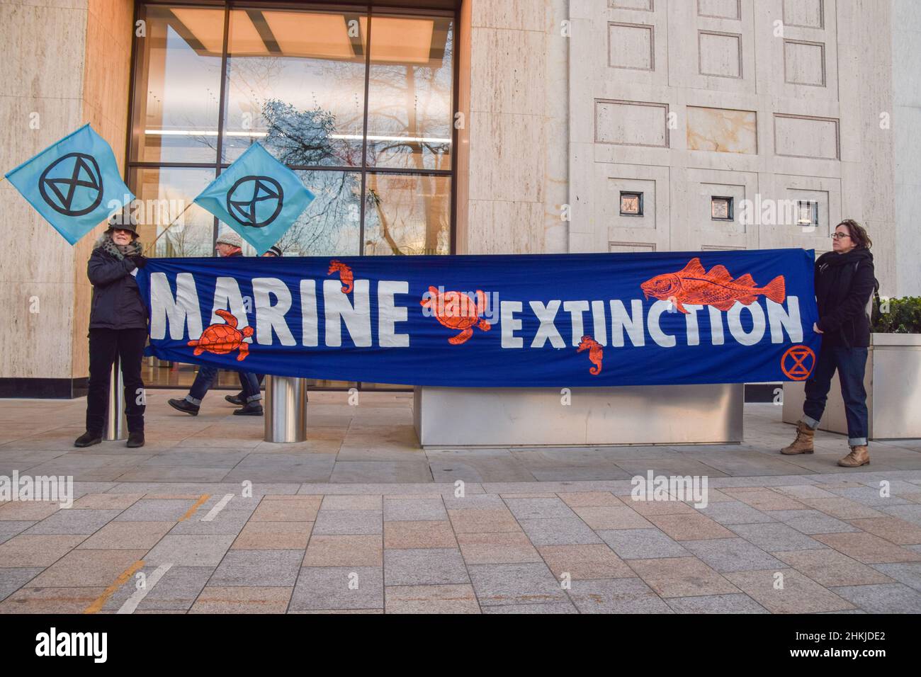Demonstrators hold a 'Marine Extinction' banner during the protest outside Shell. Activists marched with a model whale from Parliament Square to Shell's London headquarters as part of the Global Coastline Rebellion, in protest against the destruction of oceans and ocean wildlife caused by fracking, drilling, seismic surveys and pollution by oil companies. (Photo by Vuk Valcic / SOPA Images/Sipa USA) Stock Photo