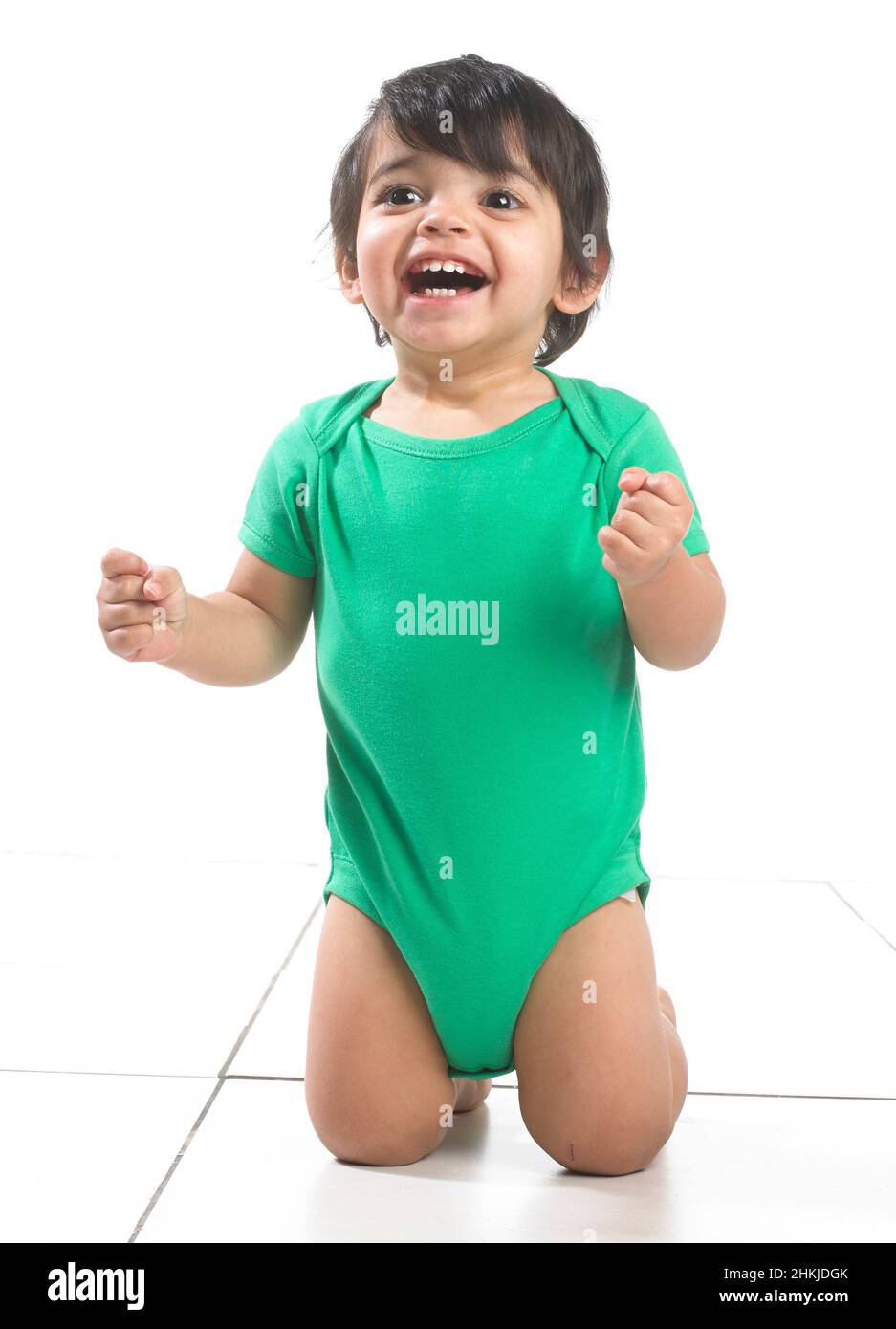 Baby boy kneeling Stock Photo Alamy