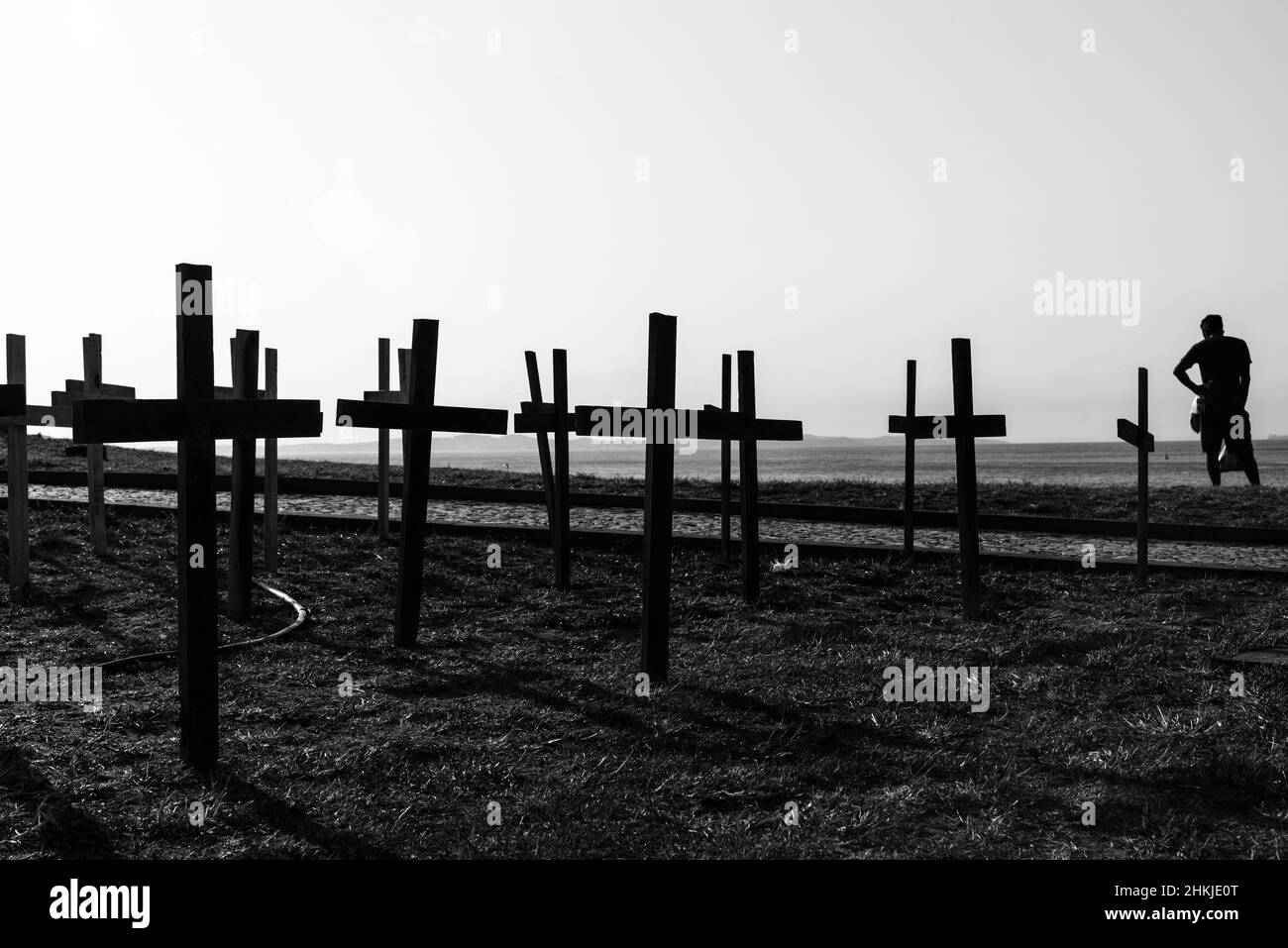 Crosses fixed to the ground in honor of those killed by Covid-19 at Farol da Barra in Salvador, Bahia, Brazil. Stock Photo