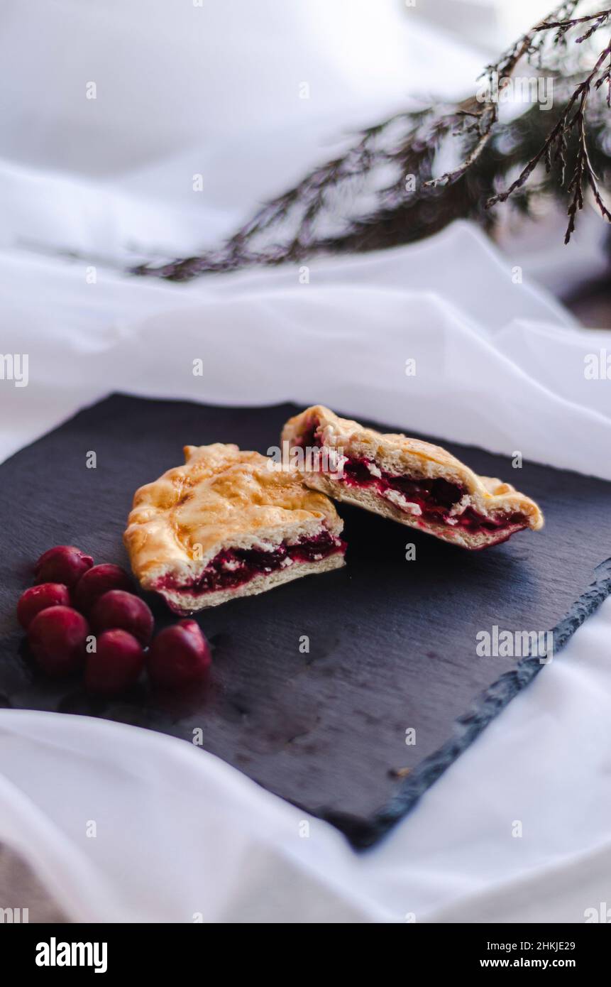 traditional cherry pie on a dark plate Stock Photo