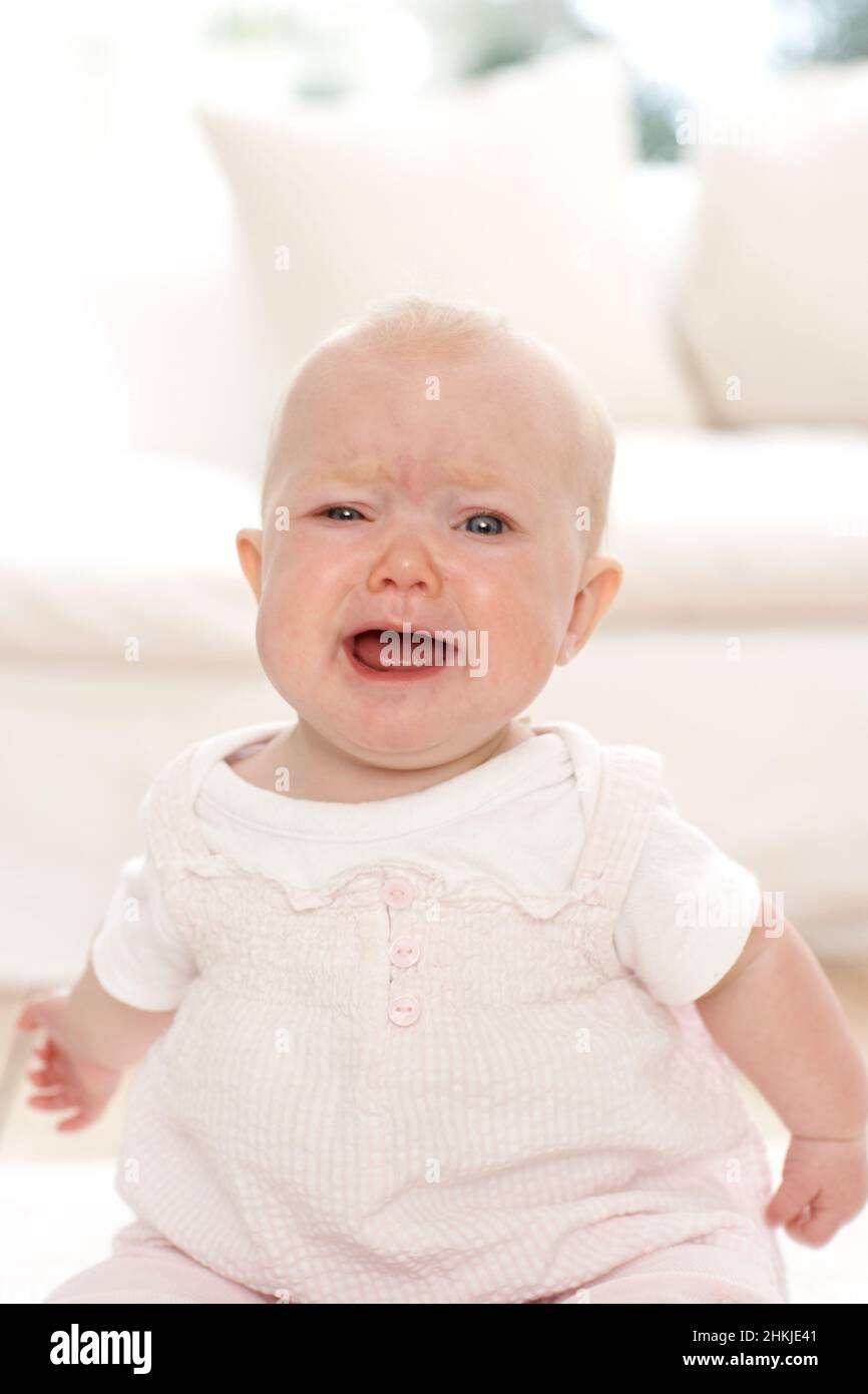 Crying baby girl with mouth open Stock Photo Alamy