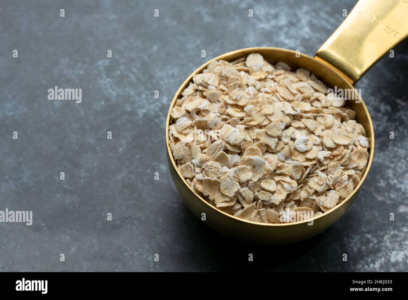 Rolled Oats in a Measuring Cup Stock Photo Alamy