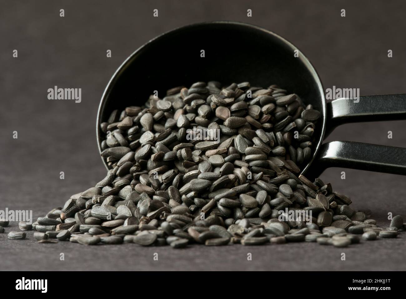 Black Sesame Seeds Spilled from a Teaspoon Stock Photo Alamy