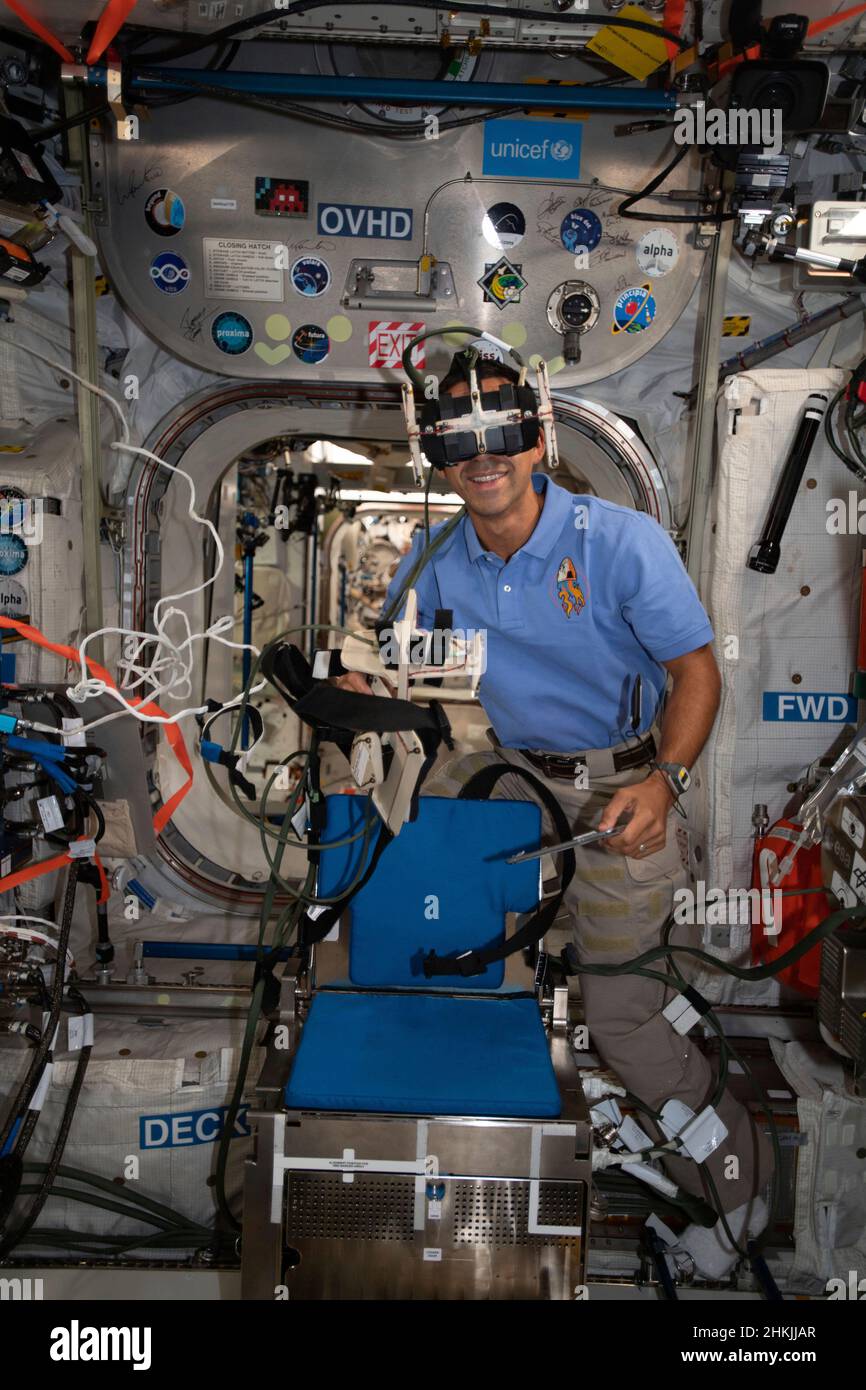 NASA astronaut wearing virtual reality goggles on the ISS Stock Photo ...