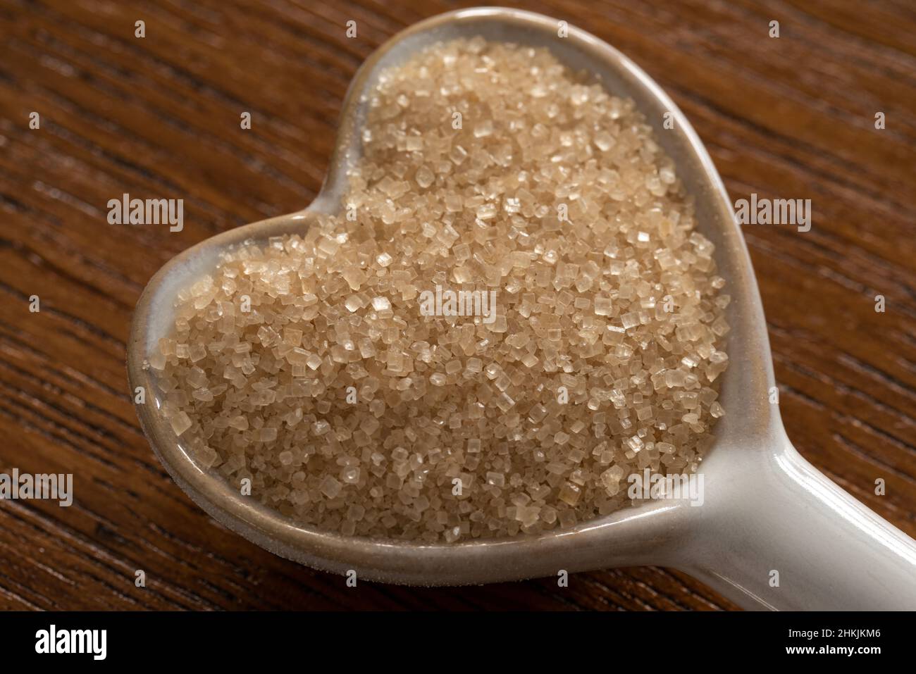 Cane Sugar on a Heart Shaped Spoon Stock Photo