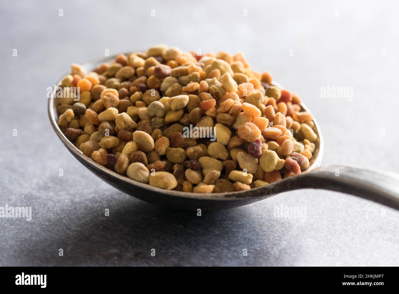 Bee Pollen on a Vintage Spoon Stock Photo