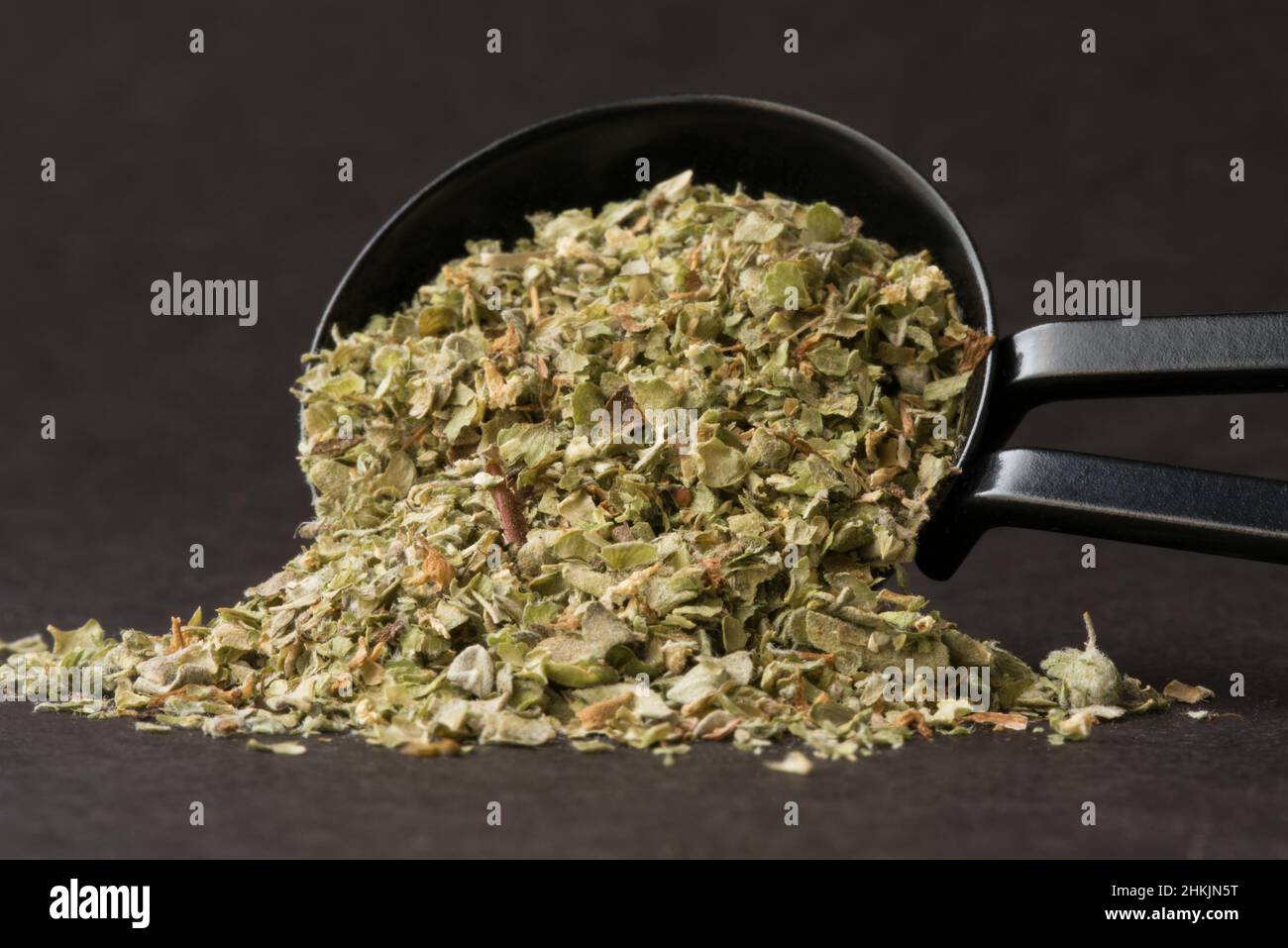 Dried Marjoram Herb Spilled from a Teaspoon Stock Photo Alamy
