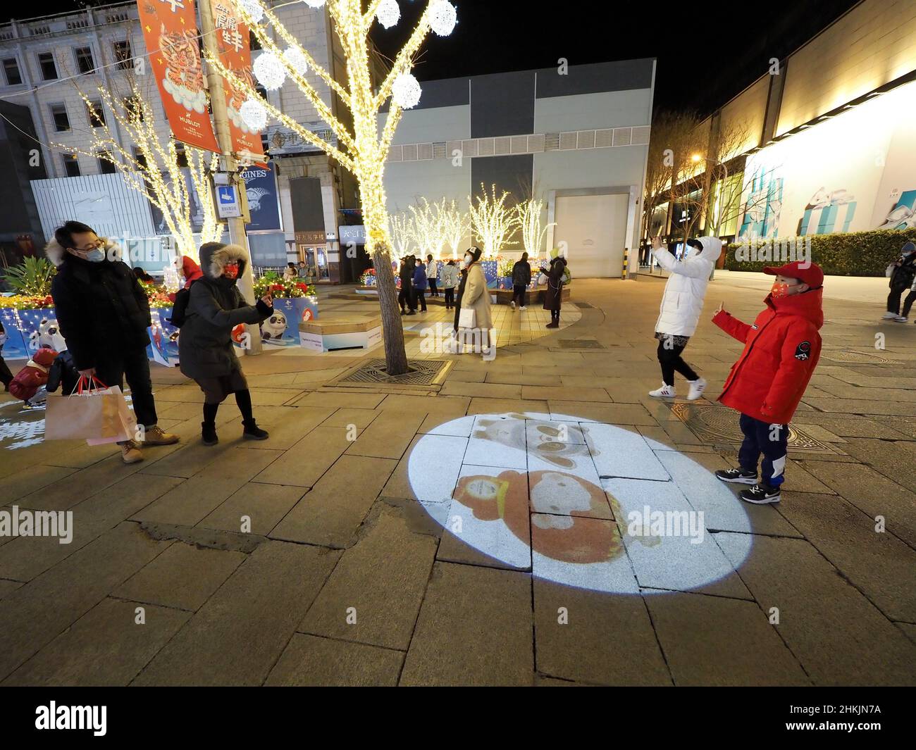 Beijing, China. 05th Feb, 2022. BEIJING, CHINA - FEBRUARY 4, 2022 -  Citizens take photos in front of a countdown board for the 2022 Winter  Olympic Games in Wangfujing, Beijing, Feb 4,