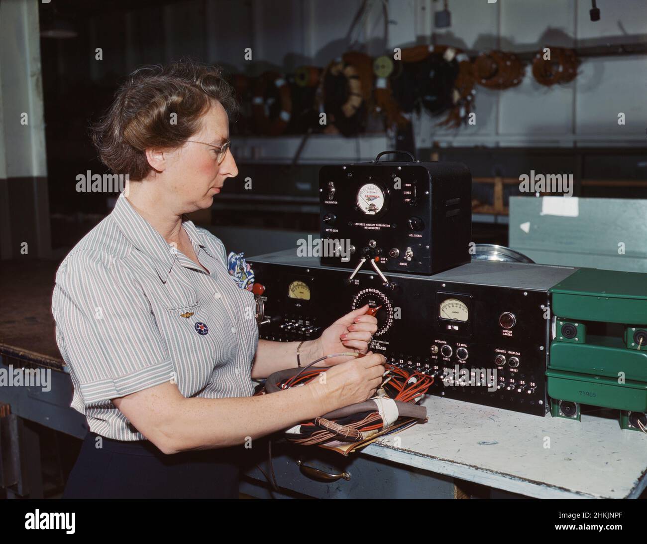 Woman working with the electric wiring at Douglas Aircraft Company, Long Beach, California, USA, Alfred T. Palmer, U.S. Office of War Information, October 1942 Stock Photo