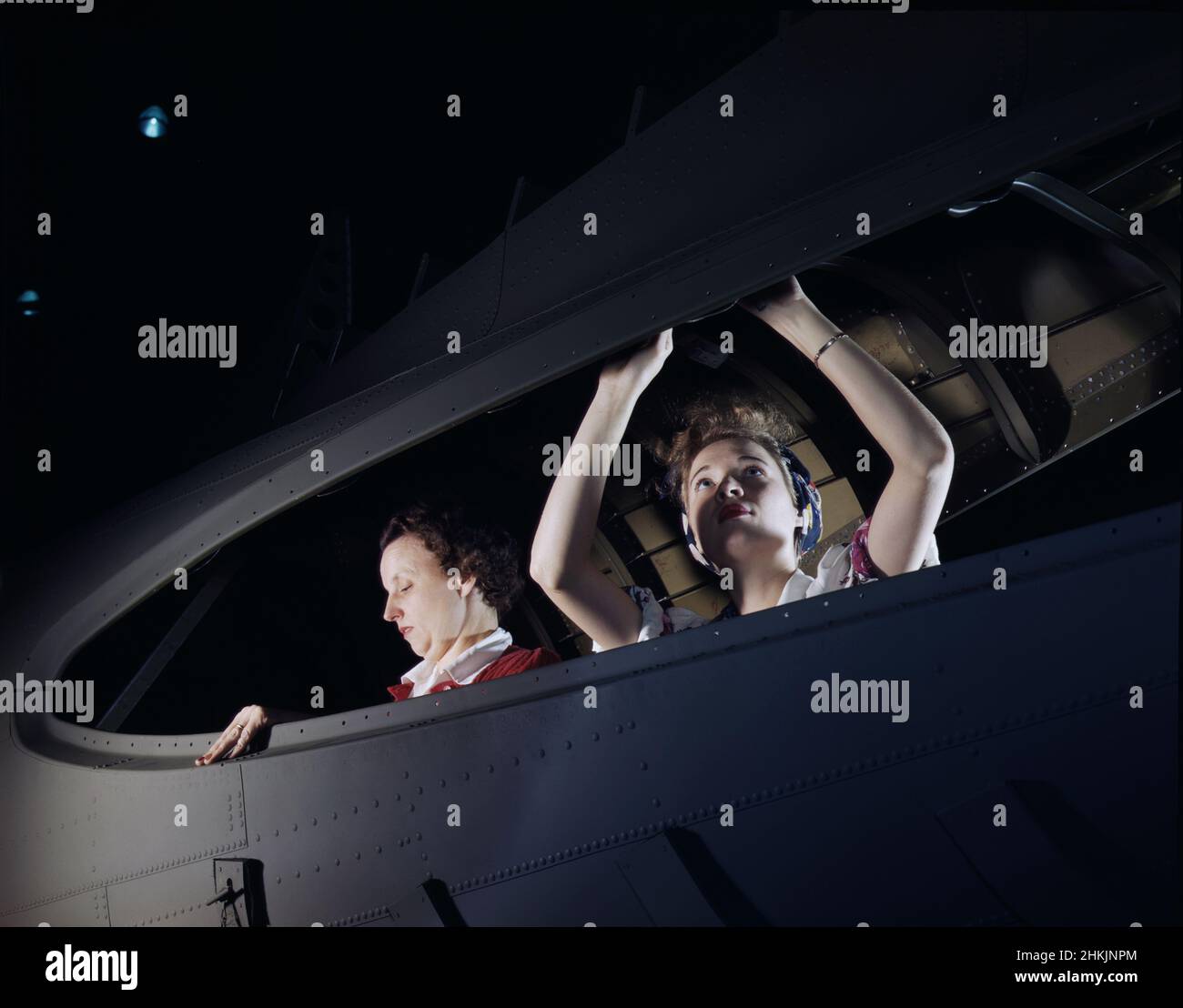 Two Women working on Bomber, Douglas Aircraft Company, Long Beach, California, USA, Alfred T. Palmer, U.S. Office of War Information, October 1942 Stock Photo