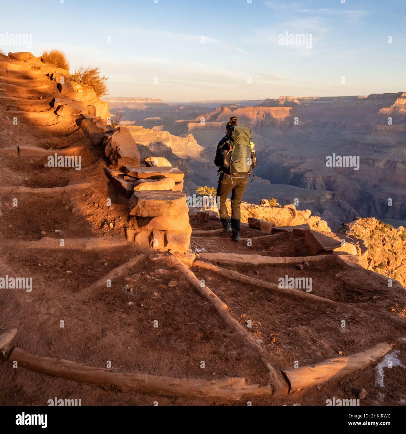 Hiker Heads Down South Kaibab Trail Switchback toward the bottom of the Grand Canyon Stock Photo