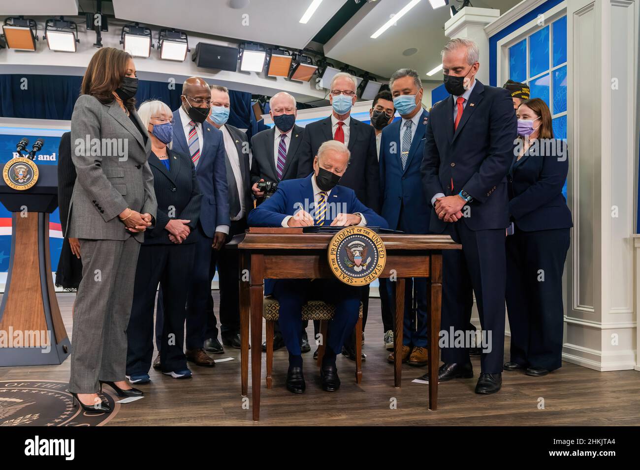 President Joe Biden, joined by Vice President Kamala Harris and Secretary of Veterans Affairs Denis McDonough, front row at right, signs the “Requiring the GAO Report on Race and Ethnicity Bill”, one of four bipartisan Veterans bills that he signs Tuesday, November 30, 2021, in the South Court Auditorium in the Eisenhower Executive Office Building at the White House. (Official White House Photo by Cameron Smith) Stock Photo