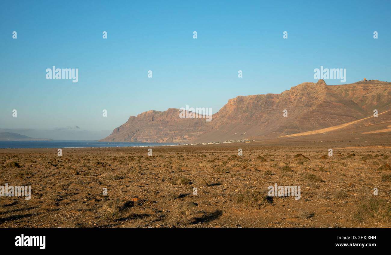 Cliffs of Famara, view from the sandy plain El Jable, Canary Islands, Lanzarote Stock Photo