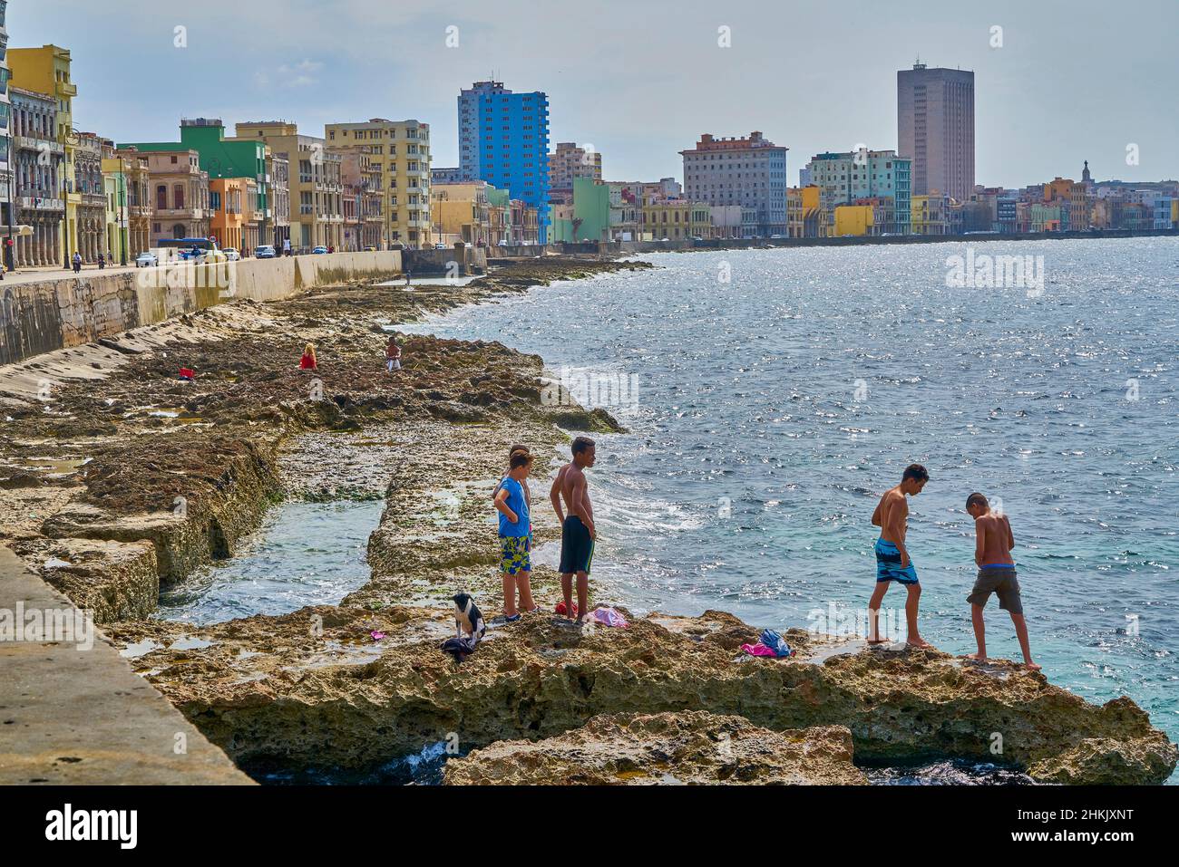 Teens bathing at Malecon in the bay Caleta de San Lazaro, Cuba, La Habana Stock Photo