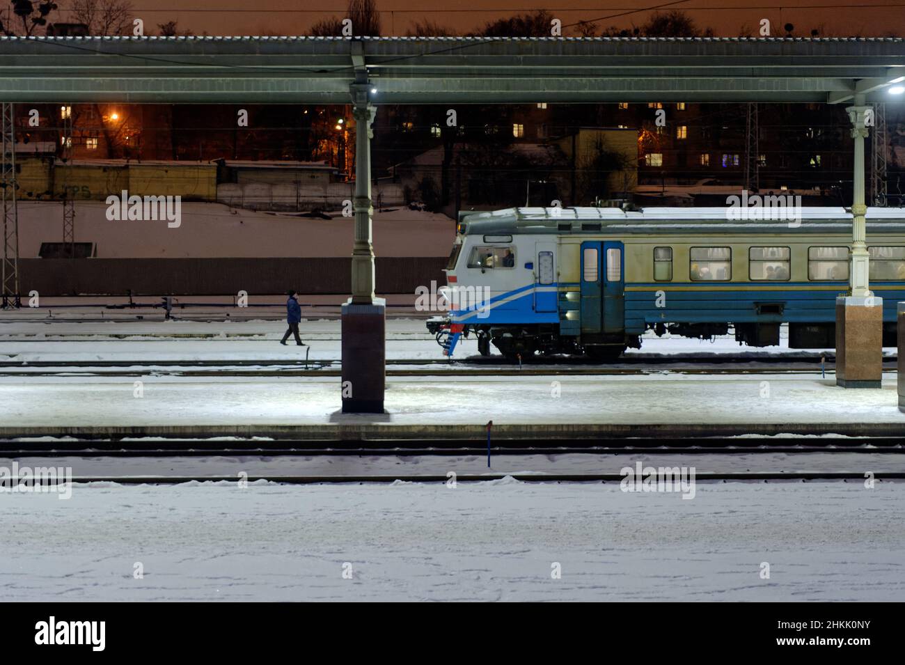 Kharkiv, Ukraine - January 28, 2022: Old electric train of Ukrainian Railways stand near the station platform in Kharkiv Passenger Railway Station. Ni Stock Photo