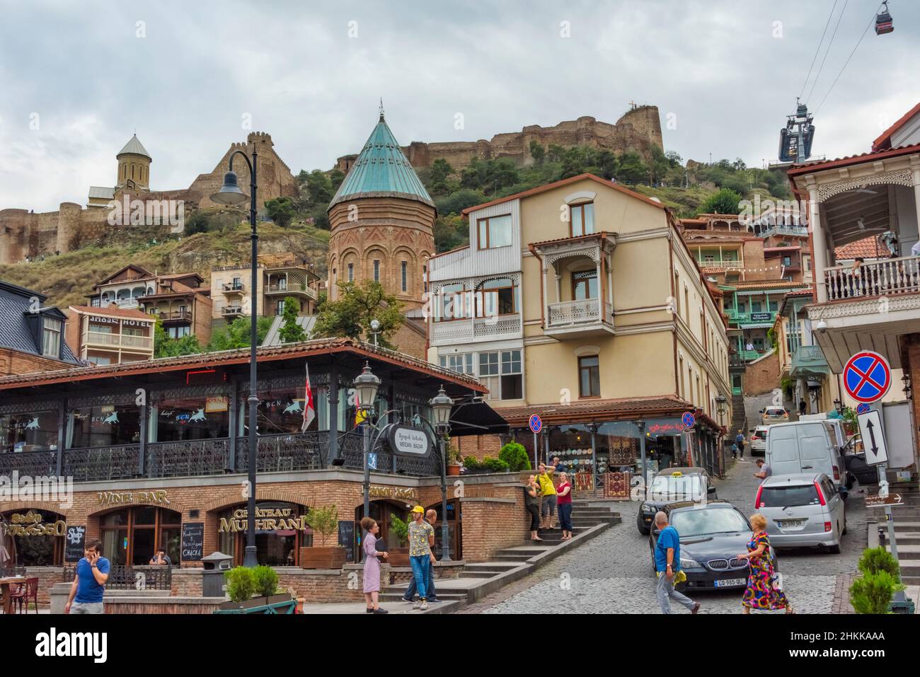 Street view in Chardin area, Narikala Fortress and Saint Nicholas Church perched on high cliff, Tbilisi, Georgia Stock Photo