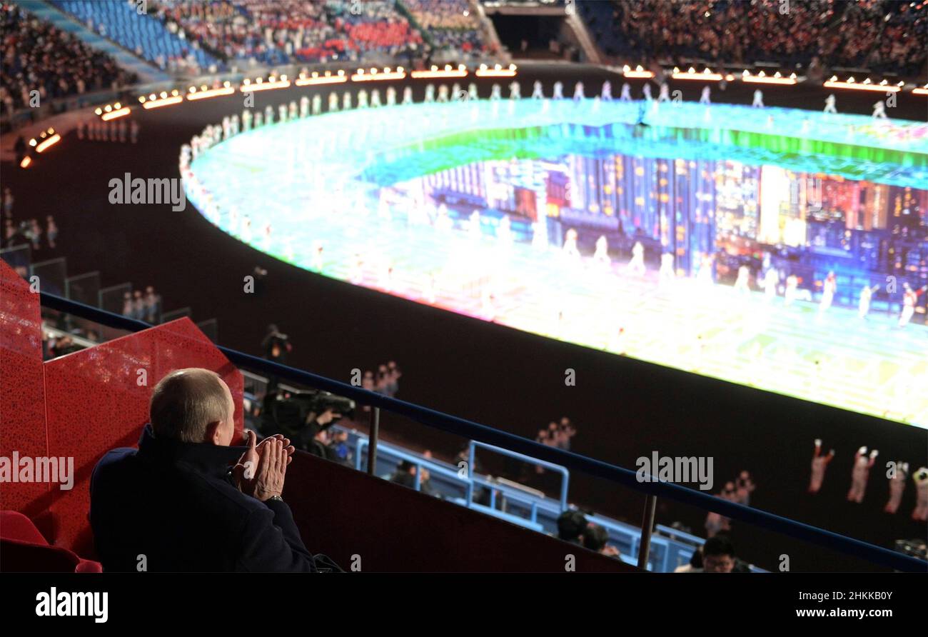 Beijing, China. 04th Feb, 2022. Russian President Vladimir Putin applauds during the opening ceremony of the 2022 Beijing Winter Olympics in the VIP section of National Stadium, February 4, 2022 in Beijing, China. Putin attended the Olympics as a guest of Chinese President Xi Jinping. Credit: Alexei Druzhinin/Kremlin Pool/Alamy Live News Stock Photo